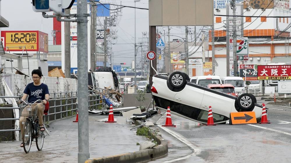 Japan floods: Death toll rises as PM warns of 